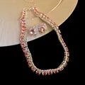 Close-up of elegant pink crystal necklace and matching stud earrings set with zircon stones - Necklace and Earrings (2-Piece) / Pink