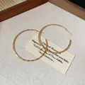 Minimalist large golden hoop earrings with an elegant circular design for women - 5cm / Gold