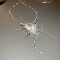 Elegant silver-toned butterfly necklace featuring soft white feathers and shiny rhinestones - 40# Necklace (Silver Feather Tassel) / Silver