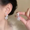 Detailed macro view showing the sparkling rhinestones on snowflake pearl earrings. - Silver Post Snowflake Pearl Studs (1#)