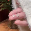 Close-up detail of silver snowflake drop earrings decorated with small crystals - Silver Post Snowflake Ear Threader (12#)