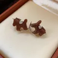 Elegant brown velvet rocking horse stud earrings featuring sparkling silver horse saddle - Diamond Flocked Horse (50#)