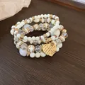 Bohemian multi-layered beaded bracelet featuring cream beads and a heart-shaped charm - Heart Pendant Stacking Style (21#) / Off White