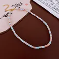 Retro geometric beaded necklace with blue and coral square beads and gold accents. - Light Blue