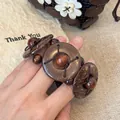 Detail view of a handcrafted dark wood bead bracelet in an ancient Chinese style. - 20# Bangle (20#) / Brown