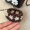 Close-up detail showing the intricate floral pattern of this Neo-Chinese wood bead bracelet - 24# Bangle (24#) / Coffee/Beige/Star
