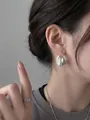Stylish silver brushed metal geometric hoop earrings shown clearly on a model's ear - Multi-layer Overlapping Semicircle Geometric Ear Clip (3#) / Silver