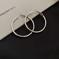 Detailed macro view of minimalist large silver hoop earrings with a polished metallic finish - Minimalist Geometric Hoop Ear Clip (22#) / Small 4CM / Silver