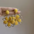 Detailed close-up of yellow woven flower earrings with gold-tone metallic edges - 1# Silver Post - Gold - Yellow