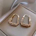 Detailed view of gold-plated U-shaped hoop earrings with sparkling cubic zirconia - Rhinestone Geometric Style / Gold (Style F226)