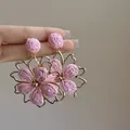 Close-up of pink woven flower earrings with gold metal frame accents - 4# Silver Post - Gold - Purple