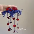 Detailed macro view of bohemian red and blue woven tassel earrings for vacation style - 7# Silver Post - Red - Blue