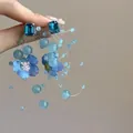 Macro shot showing detail of blue woven flower tassel earrings with faceted crystals - 9# Silver Post - Blue