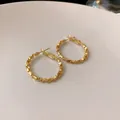 Minimalist textured gold hoop earrings featuring a stylish irregular design with silver needle posts - Uneven Texture (HE8275) / Gold