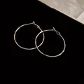Elegant silver-toned hammered texture metal hoop earrings for a minimalist look - Wavy Texture (HE8275) / Silver