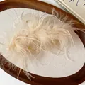 Elegant ostrich feather hair claw clip with cream fluffy texture on a minimalist tray - 4# Claw Clip