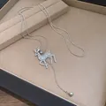 Detail of silver reindeer pendant necklace with pavé rhinestones on jewelry tray. - Necklace (Standing Reindeer)