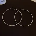 Large silver metal hoop earrings with a minimalist polished finish for a chic look. - Minimalist Large Hoop (HE8275) / Silver