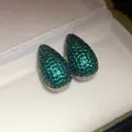 Macro view of teardrop stud earrings paved with sparkling green zircons in jewelry box - Pave Teardrop Style (9#)
