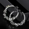 Macro detail of silver hoop earrings with sparkling rhinestones and hexagonal sequins - S925 Silver Needle Style / Silver