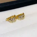 Detail showing 18k gold plated earrings with quilted pattern and zircon stones - Grid Pattern Square Hoop