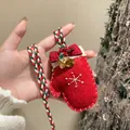 Close-up of festive red plush mitten pendant necklace with bells and snowflake detail - Christmas Glove (Red)