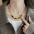 Detailed close-up of a Maillard style necklace with tiger eye stones and gold accents - 1# Necklace-Gold-Brown