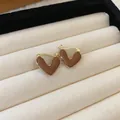 Close-up macro detail of retro Maillard brown heart earrings with elegant gold trim - Heart Ear Clip (HE16356)