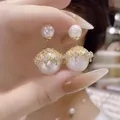 Elegantes pendientes de doble perla con detalle de corona de cristal en acabado dorado - Chapado en Oro Malla (18#)