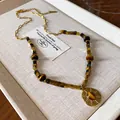 Vintage-style Maillard artificial tiger eye stone necklace with golden medallion pendant - 37# Necklace - Gold - Coffee - Stainless Steel