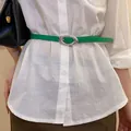 Stylish green thin leather belt with a silver oval buckle on a white shirt. - Silver Oval Buckle Thin Style (HN10229)