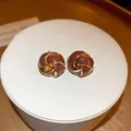 Vintage French style coffee brown enamel flower stud earrings with gold trim details. - Retro Flower Knot (HE16436)