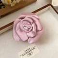 Detailed view of the pink satin fabric rose flower petal texture on hair claw clip - Hair Claw - Pink
