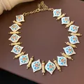 Detail of vintage palace-style necklace with white enamel hearts and pink crystals - 50# Necklace-Vintage Enamel Blue Heart Style / Gold-Blue