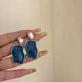 Elegant irregular geometric stud earrings with dark blue marbled resin - Irregular Earrings