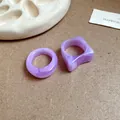 Close-up of purple marbled acrylic geometric rings on minimalist background - Irregular Geometric (6021388831369)