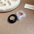 Close-up macro view of irregular acrylic geometric rings with a unique marbled texture finish - Irregular Geometric (6021388831365)