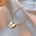 Elegant gold-plated butterfly pendant necklace featuring white pearlescent wings and rhinestones - Style 50 (Real Gold Plated)