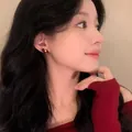 Red flocked horse stud earrings with silver needle worn by a model in a close-up shot - Pony Shape (Silver Post) / Gold-Red