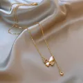Elegant gold butterfly pendant necklace with sparkling rhinestones and pearl finish - Style 53 (Real Gold Plated)