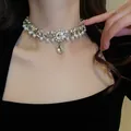 Detailed macro view of double-layer rhinestone necklace with pearls and teardrop pendant - 26#项链(常规)