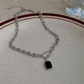 Elegant silver chain necklace featuring a bold black rectangular pendant charm jewel - Black Square Pendant Style