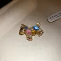 Detailed view of a luxury vintage horse brooch embellished with colorful sparkling rhinestones - Colorful