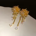 Élégantes boucles d'oreilles pendantes feu d'artifice plaquées or 18 carats et zircon - Style de Gland de Feu d'Artifice / Or