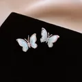 Elegante silberfarbene Schmetterlingsohrstecker mit hellblauer Steindetail-Inlay Optik - 19# Butterfly Rhinestone Style / Blau/Silber