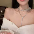 Elegant sparkling silver Y-shaped rhinestone choker necklace displayed on a model - Silver Rhinestone Tassel Necklace