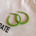 Vibrant lime green flocked hoop earrings with a soft velvet texture for a trendy look. - Green