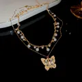 Elegant vintage-style double-layered necklace featuring a butterfly pendant and pearls. - Butterfly Stacked Style (2 Piece Set) / Gold