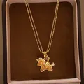 Primer plano de un collar con colgante de unicornio dorado con circonitas brillantes - 7# Collar-Dorado-Unicornio de doble capa (Chapado en oro real)