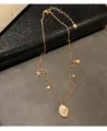 Collier doré style palais vintage avec breloques étoiles et pendentif ovale - Collier - Or (Plaqué Or)